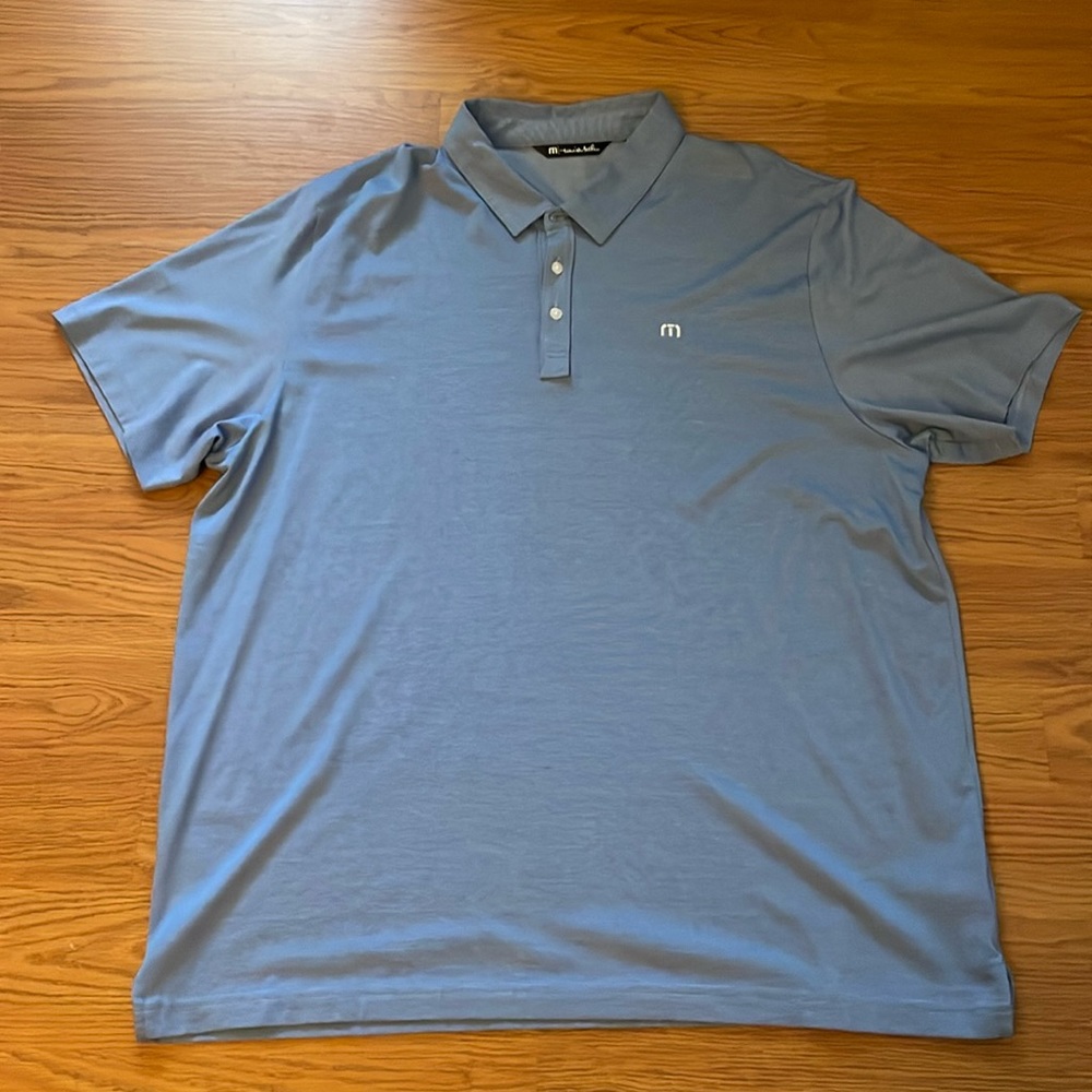 I’m selling a used Blue XXXL Travis Matthew polo